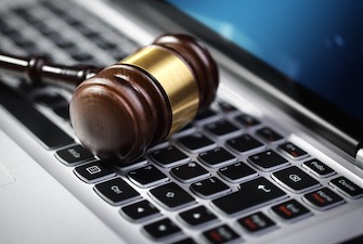 Computer Fraud and Abuse Act - https://depositphotos.com/63467245/stock-photo-justice-gavel-and-laptop-computer.html