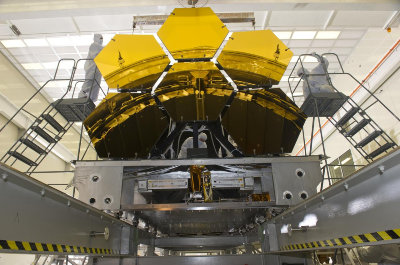 Ball Aerospace technicians remove final six JWST mirrors after testing, from NASA. Public domain.