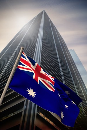 Australia national flag against low angle view of skyscraper