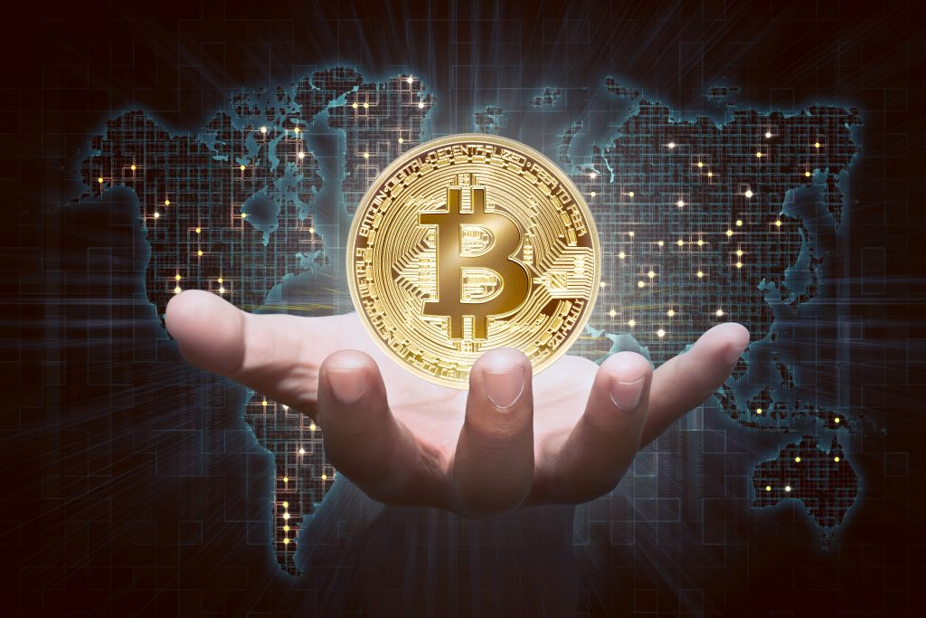 bitcoin - https://depositphotos.com/180949828/stock-photo-male-hand-showing-golden-bitcoin.html