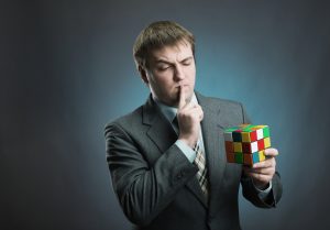https://depositphotos.com/44567625/stock-photo-businessman-holding-rubik-cube.html